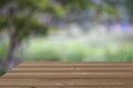 Wooden board empty table blur trees background