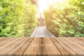 Wooden board empty table blur trees in forest background - can be used mock up for display or montage your products. Royalty Free Stock Photo