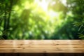 Wooden board empty table blurred background. Perspective brown wood table over blur trees forest background - can be used mock up Royalty Free Stock Photo