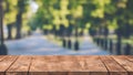 Empty wooden board table in front with blurry background Royalty Free Stock Photo