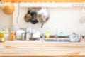 Wooden board empty table in front of Blur image of traditional Kitchen Room