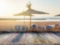 Wooden board empty table in front of blurred background. It can be used for display or montage your products. Sandy beach, Royalty Free Stock Photo