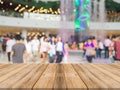 Wooden board empty table in front of blurred background. Perspective brown wood over blur people in shopping mall - can be used f Royalty Free Stock Photo