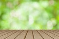 Wooden board empty table in front of blurred background. Perspective brown wood table over blurred trees with bokeh background - Royalty Free Stock Photo