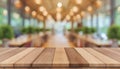 Wooden board empty table in front of blurred background. Perspective brown wood over blur in coffee shop - can be used for display Royalty Free Stock Photo