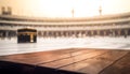 Wooden board empty table in front of blurred Kaaba in mecca background.Generative AI