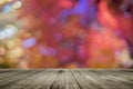 Wooden board empty table in front of colorful blurred background. Perspective brown wood over bokeh light Royalty Free Stock Photo