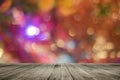 Wooden board empty table in front of colorful blurred background. Perspective brown wood over bokeh light Royalty Free Stock Photo