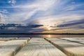 Wooden board empty table in front of sunset sea & sky background. Perspective wood floor over sea and sunset sky & summer concepts Royalty Free Stock Photo