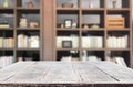 Wooden board empty table space platform in front of blurred library Of The background - can be used for display or montage your p Royalty Free Stock Photo