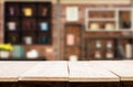 Wooden board empty Table Top And Blur Interior over blur in coffee shop Background, Mock up for display of product