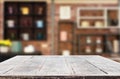 Wooden board empty Table Top And Blur Interior over blur in coffee shop Background, Mock up for display of product Royalty Free Stock Photo