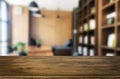 Wooden board empty Table Top And Blur Interior over blur in coffee shop Background, Mock up for display of product Royalty Free Stock Photo