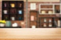 Wooden board empty Table Top And Blur Interior over blur in coffee shop Background, Mock up for display of product Royalty Free Stock Photo