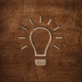 Wooden board engraved lightbulb lamp innovation creativity energy symbol