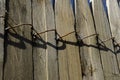 WOODEN BOARD FENCE CONNECTED BY WIRE