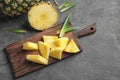 Wooden board with fresh sliced pineapple Royalty Free Stock Photo