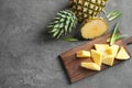 Wooden board with fresh sliced pineapple