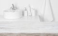 Wooden board in front of blurred domestic bathroom washbowl background Royalty Free Stock Photo