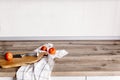 Wooden board with knife, tomatoes, towel on modern kitchen count Royalty Free Stock Photo