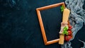 Wooden board for notes with vegetables. Menu. On the old background.