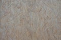 Wooden board Osb for background decoration. Pressed pieces of plant waste materials