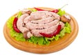 Wooden board with raw sausages, mushrooms, lettuce and pepper .