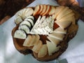 Wooden board with tasty assortment of cheese Royalty Free Stock Photo