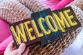 Wooden board with text welcome in man hand. Bali island. Welcome sign. Royalty Free Stock Photo