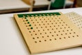 Wooden board to learn to count numbers and do mathematical operations Royalty Free Stock Photo