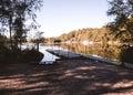 Wooden board walk or jetty in  a lake near a bathing place in sÃÂ´gothenburg sweden , No people because of COVID Royalty Free Stock Photo