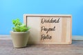 Wooden board written with text DIVIDEND PAYOUT RATIO