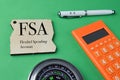 Wooden board written with FSA stands for Flexibel Spending Account