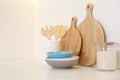 Wooden boards and different kitchen items on countertop