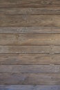 Wooden boards are located horizontally. Cracked, wood knots Royalty Free Stock Photo