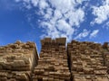 Wooden boards, lumber, industrial wood, timber. Pine wood timber stack of natural rough wooden boards on building site Royalty Free Stock Photo