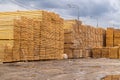 Wooden boards, lumber, industrial wood, timber. Pine wood timber stack of natural rough wooden boards on building site Royalty Free Stock Photo