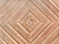 Wooden boards nailed in the shape of a diamond. Element of decor