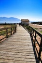 Wooden boardwalk along the beach in Isla Plana village Royalty Free Stock Photo