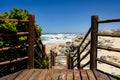 Wooden boardwalk leading to the beach in Keurboomstrand, South Africa Royalty Free Stock Photo
