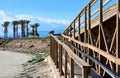 Wooden boardwalk leading to the Retamar beach Royalty Free Stock Photo