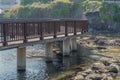 Wooden boardwalk over small inlet of water