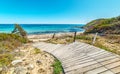 Wooden boardwalk in Scoglio di Peppino beach Royalty Free Stock Photo