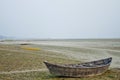 A wooden boat on the bank of the dry river at Dhaka, Bangladesh Royalty Free Stock Photo