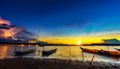 Wooden boat at banks of the river with sunset in Khonburi, Nahon Ratchasima, Thailand Royalty Free Stock Photo