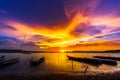 Wooden boat at banks of the river with sunset in Khonburi, Nahon Ratchasima, Thailand Royalty Free Stock Photo