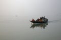 Wooden boat crosses the Ganges River in Sundarbans, West Bengal