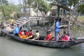 Wooden boat crosses river in Gosaba, India
