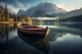 Wooden boat on the crystal lake with majestic mountain behind. Reflection in the water. Royalty Free Stock Photo