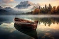 Wooden boat on the crystal lake with majestic mountain behind. Reflection in the water. Royalty Free Stock Photo